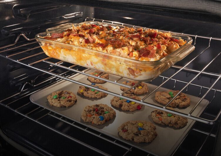 The inside an Amana® range baking cookies and a casserole. The inside an Amana® range baking cookies and a casserole.