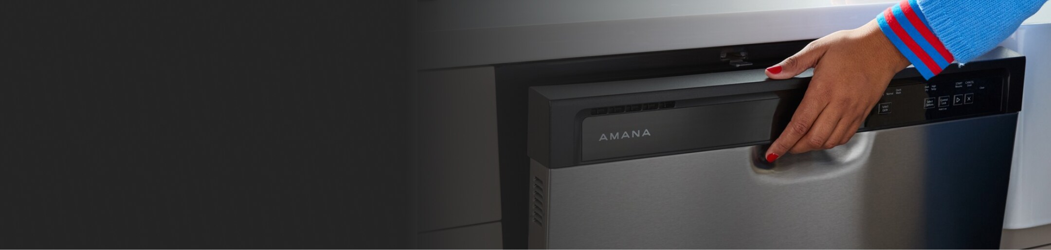 A person opening an Amana® dishwasher.