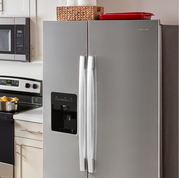 An Amana® refrigerator in a kitchen.
