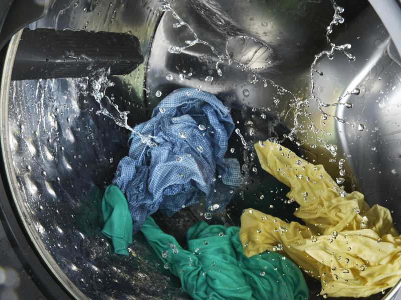 Clothes being washed inside a washing machine