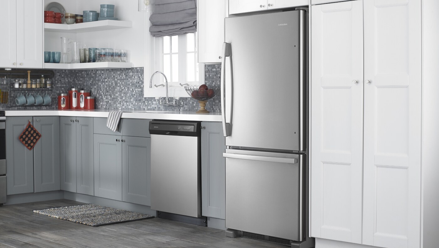 Amana® appliances set in white and grey cabinetry Amana® appliances set in white and grey cabinetry