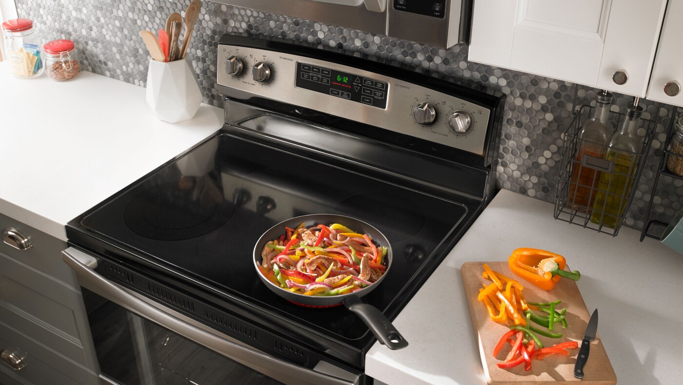 Food cooking on stovetop of stainless steel Amana® range Food cooking on stovetop of stainless steel Amana® range