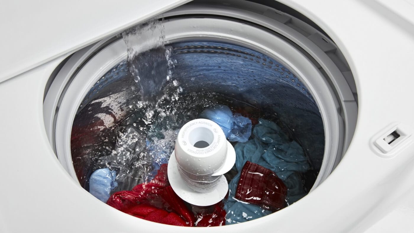 Water flowing into a washing machine Water flowing into a washing machine