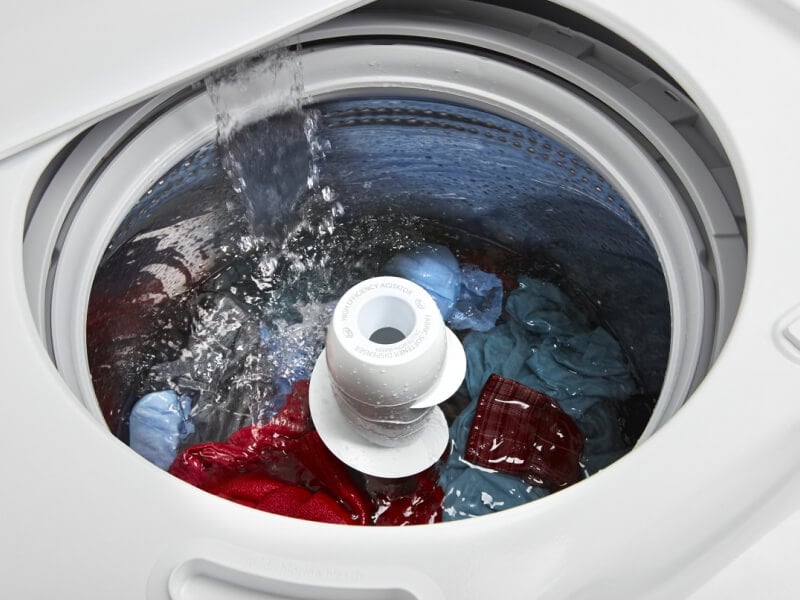 Water flowing into a washing machine Water flowing into a washing machine