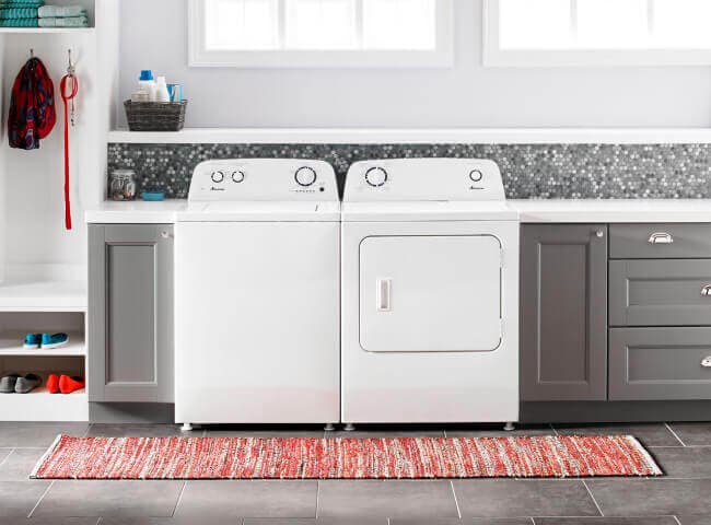 Amana® washer and dryer pair in laundry room