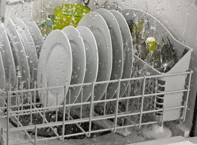 Side interior view of dishes in dishwasher