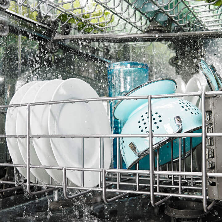 Front interior view of dishes loaded in dishwasher