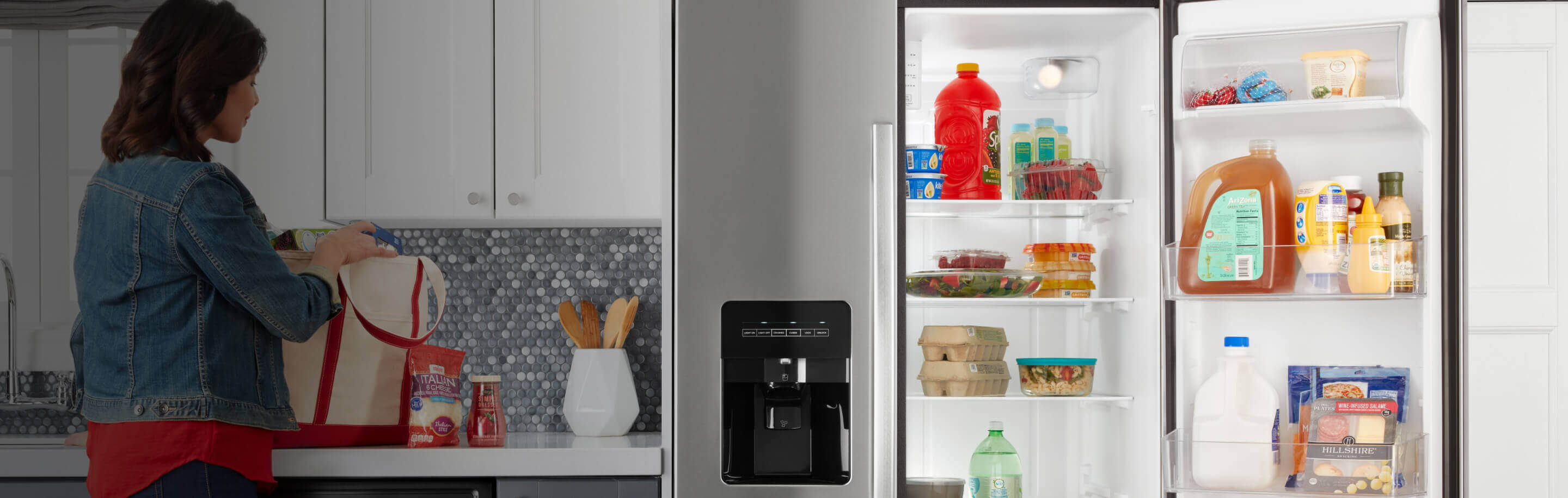 Open Amana® refrigerator in kitchen