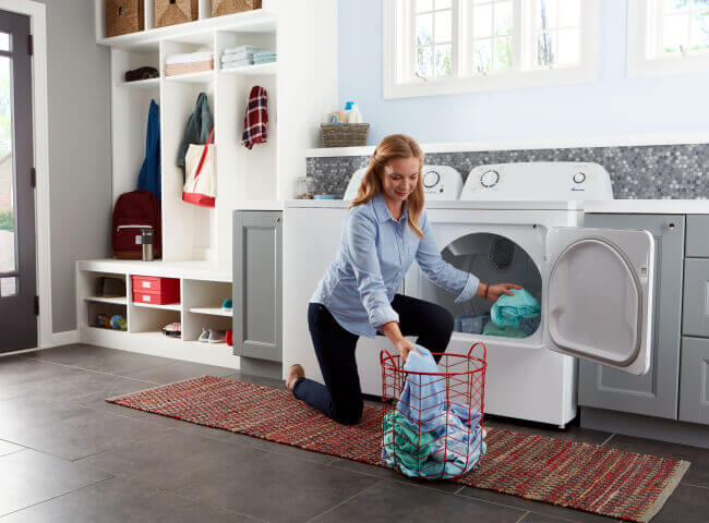 Person unloading clothes from a dryer
