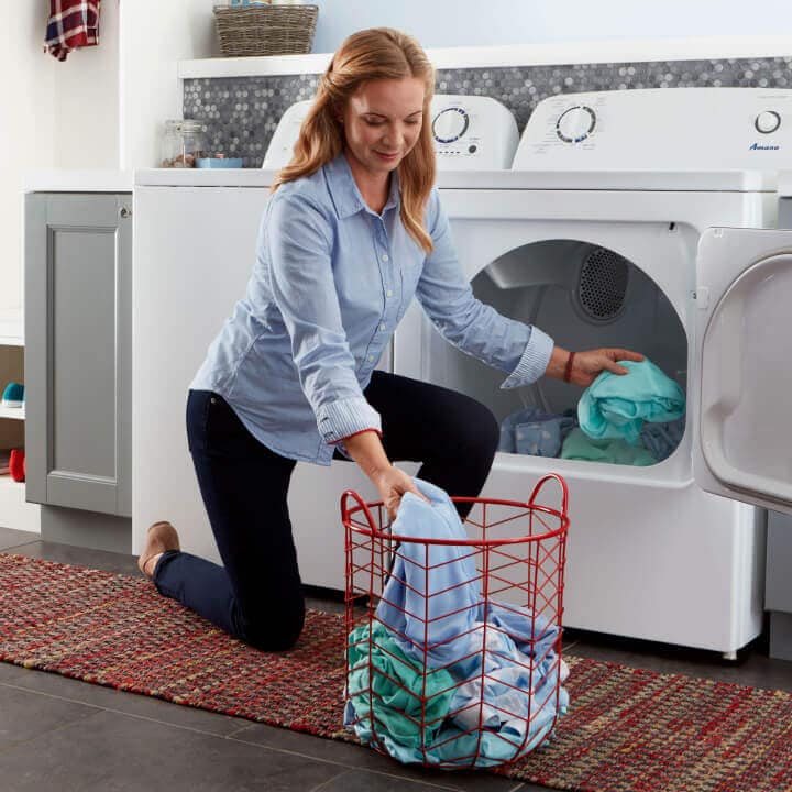 Person unloading clothes from a dryer