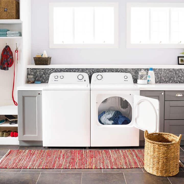 Amana® washer and dryer pair with dryer door open