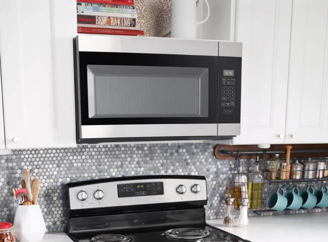 Amana® range and microwave in kitchen