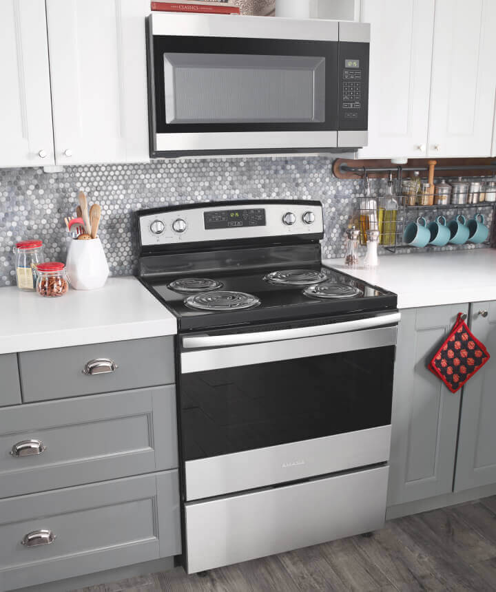 Amana® range and microwave in kitchen