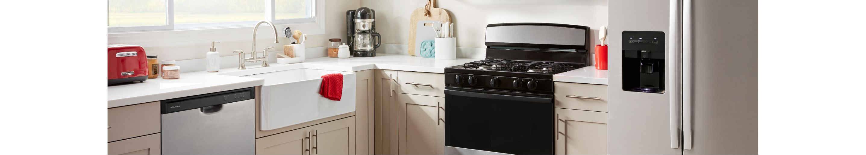 An Amana® dishwasher, range and refrigerator in a kitchen.