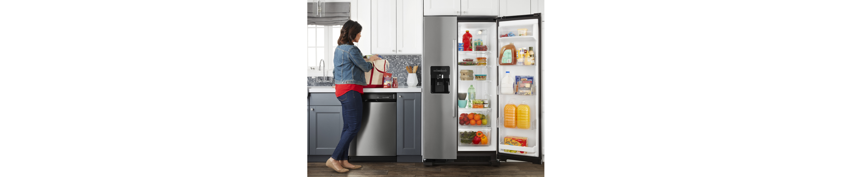 Amana® side-by-side refrigerator open on one side
