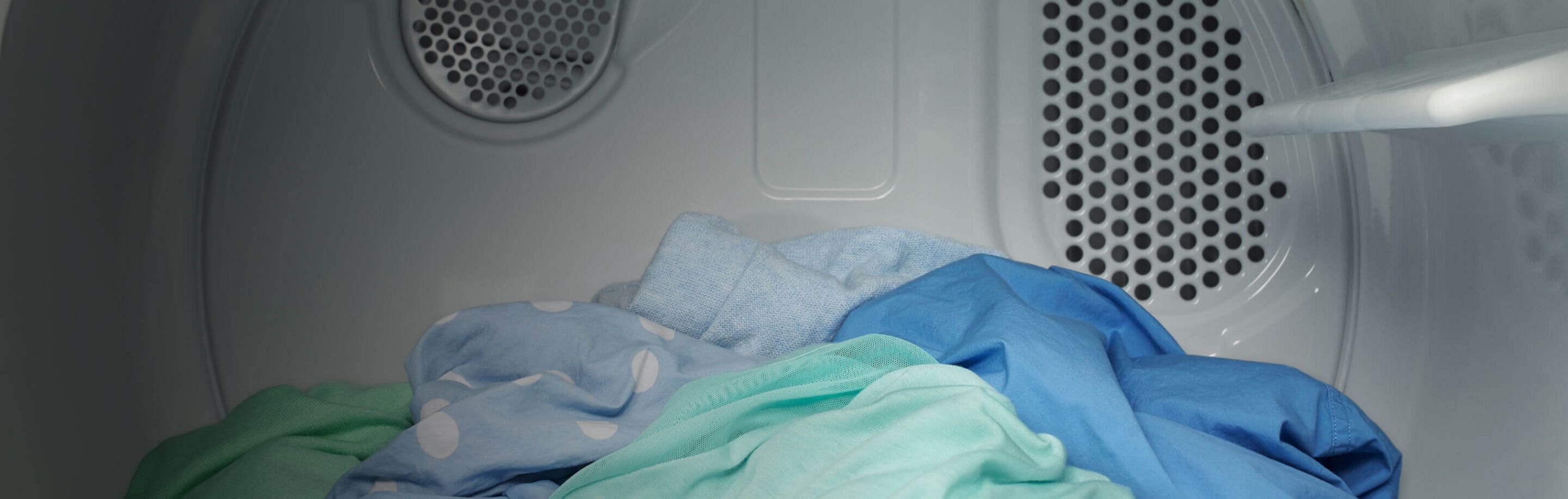 Interior of Amana® dryer with clothes inside