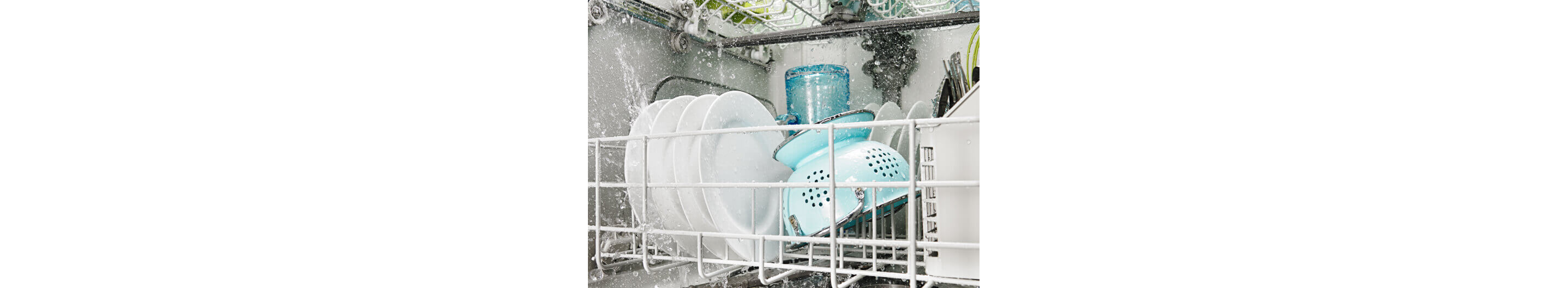 Front interior view of dishes loaded in dishwasher