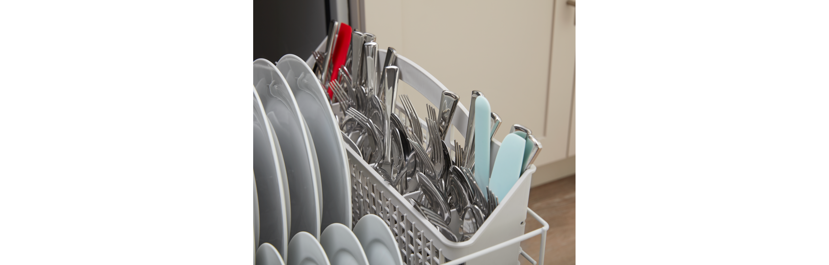 Dishes inside an Amana brand dishwasher