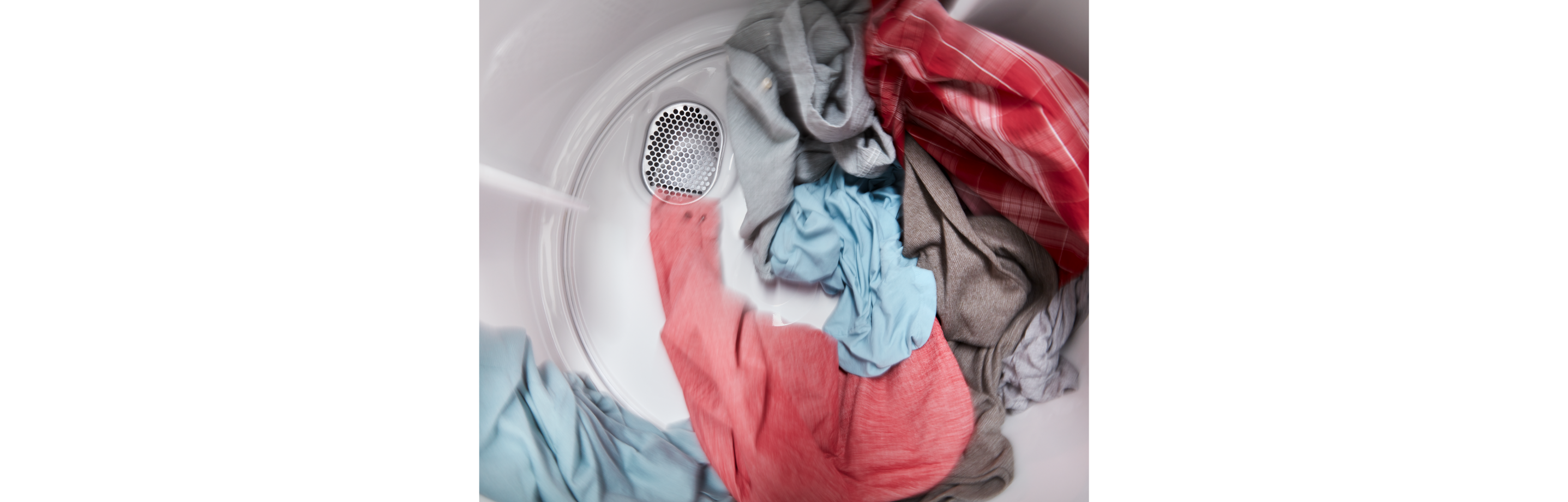 Clothes tumbling inside an Amana brand dryer